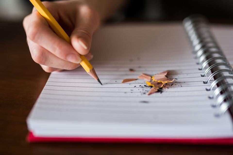 Illustrative photograph of notebook Pencil